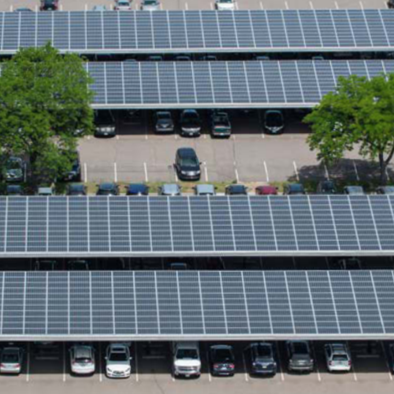 Aerial view of solar photovoltaics on a parking facility.