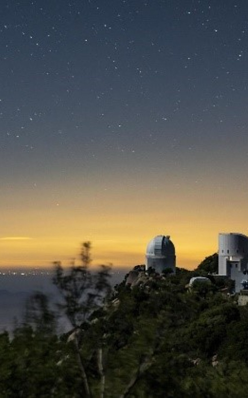The Dark Energy Spectroscopic Instrument at the Mayall Telescope at Kitt Peak National Observatory will use 5,000 robotic “eyes” to map the history of cosmic expansion. 