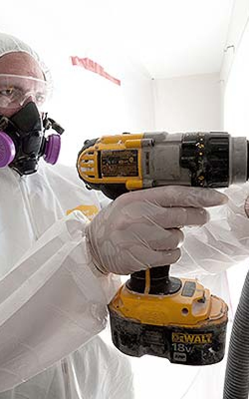Image of worker weatherizing a wall