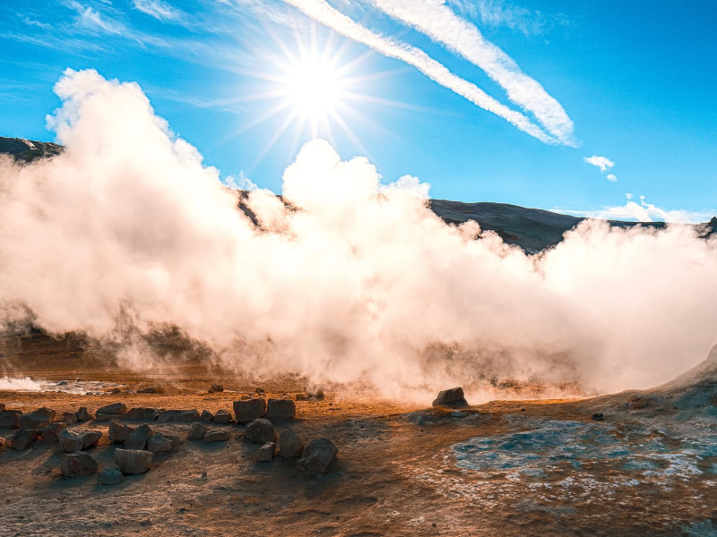 a photo of a steam vent in the desert.