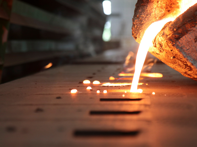 molten metal being poured into a cast