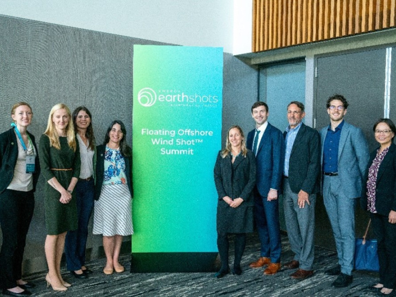A group of people standing for a photo at a conference