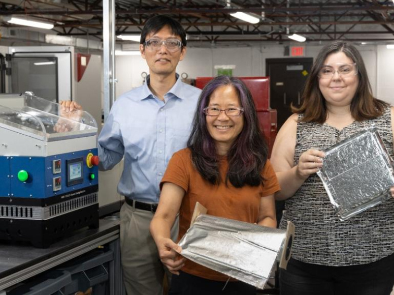 ORNL researchers demonstrate the self-healing barrier film that was licensed by Flexcon to incorporate into vacuum insulation panels. 