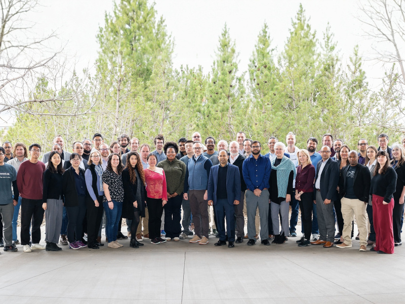 Group of people stands outside