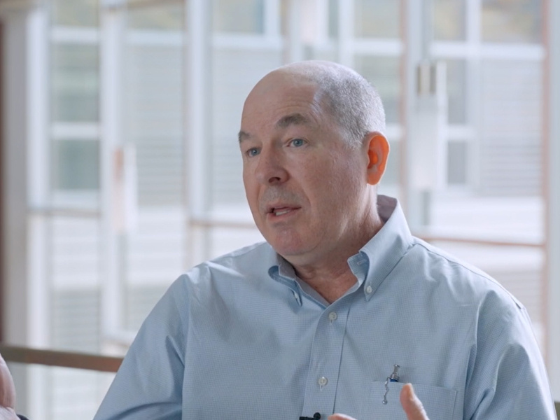 Kurmit Rockwell, Federal Energy Management Program (FEMP) Performance Contracting Team Lead, gestures while speaking about FEMP's performance contracting program.