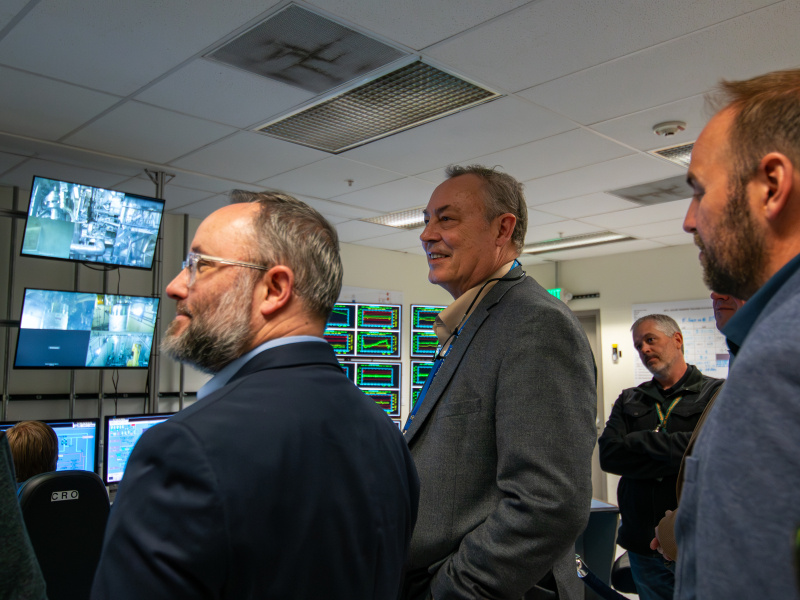 EM Leadership standing in a control room at the Idaho site