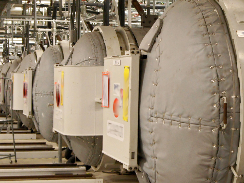 A room full of large grey autoclaves at the Portsmouth Paducah Project Office