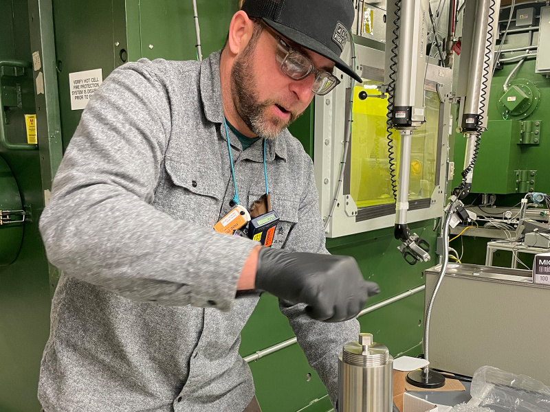 PNNL’s Jamin Trevino practicing the choreographed steps for handling the special form capsule that holds the radium-226.
