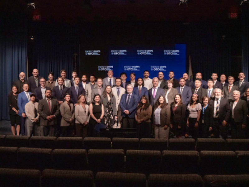 Energy I-Corps Cohort 22 members gather on stage at DOE HQ
