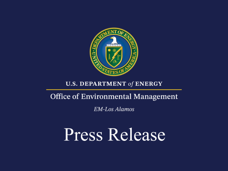DOE seal with Office of Environmental Management EM-Los Alamos and Press Release in white on a blue background