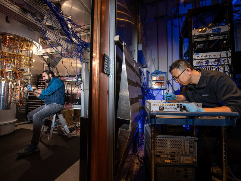 Researchers work in lab setting