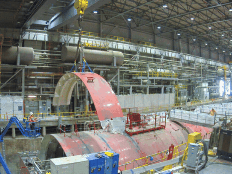 Rotating set of images of a demolition occurring inside a facility building 