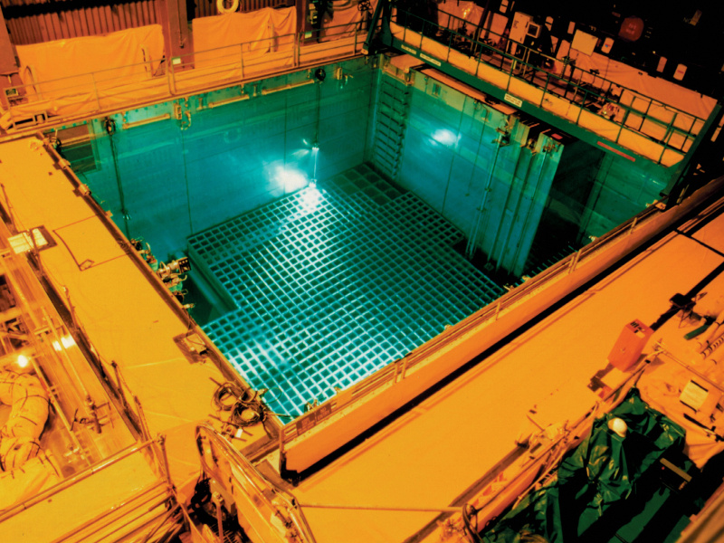 Spent Fuel Pool at the San Onofre Nuclear Generating Station, a blue pool surrounded by yellow walkways.