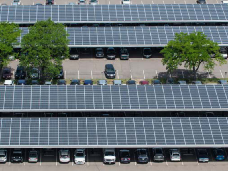 Aerial view of solar photovoltaics on a parking facility.