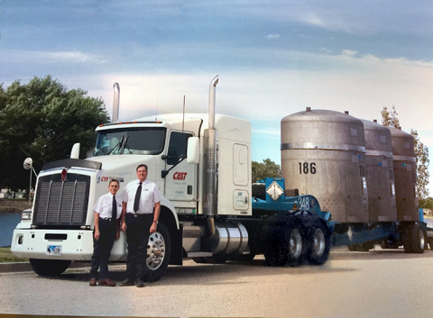 Stan and Linda Taylor in front of a WIPP truck