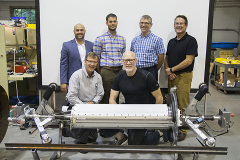 Participants in the Carnegie Mellon University (CMU) demonstration gather behind PipeDream. 
