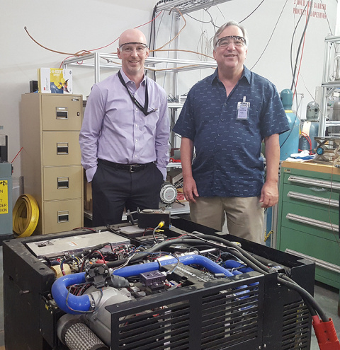 Scott McWhorter, Integrated Energy Systems Section Manager at SRNL, and Craig Jensen, President, Hawaii Hydrogen Carriers stand with the metal hydride fuel cell power system. 