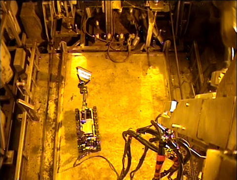 A two-foot tall robot cleaned up debris in the Defense Waste Processing Facility.