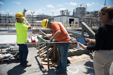 Savannah River Remediation Industrial Hygienist Sally Starling monitors two construction workers wearing physiological monitoring devices in the Savannah River Site Tank Farms.