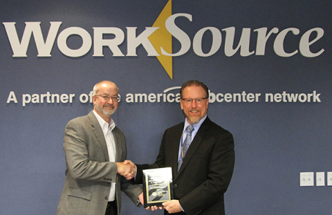 CH2M HILL Plateau Remediation Company Chief Operating Officer Dan Wood accepts the 2017 Hire-A-Vet Award from David Brown, WorkSource Columbia Basin administrator.