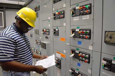 A plant startup worker checks a utility systems control panel at Hanford’s Waste Treatment and Immobilization Plant. As engineers and construction crews finish portions of the utilities, they transfer systems to the startup phase.