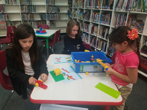 Students at Monterey Elementary School in Carlsbad assemble models during a science, technology, engineering, art, and mathematics (STEAM) activity.