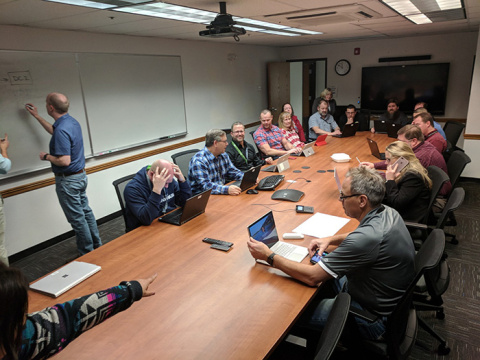 Members of the Mission Support Alliance Information Management team discuss repercussions of a data center outage at Hanford during a disaster recovery exercise.
