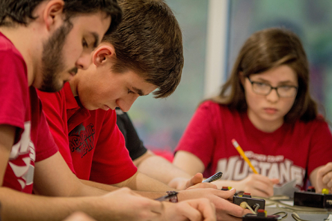 McCracken County High School students (left to right) David Dodd, Drew Schofield, Katelyn Woodard collaborate on a science problem during the competition.