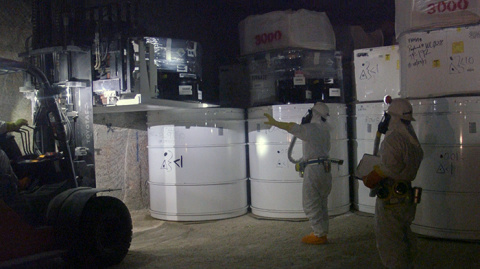 Waste handlers at the Waste Isolation Pilot Plant place containers of transuranic waste 2,150 feet underground in Panel 7. Waste containers shipped from DOE generator sites across the country are stacked in waste panels mined out of an ancient salt bed.