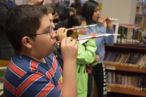 Students prepare to launch mock “rockets” as part of a lesson on aerodynamics presented by Washington River Protection Solutions staff.