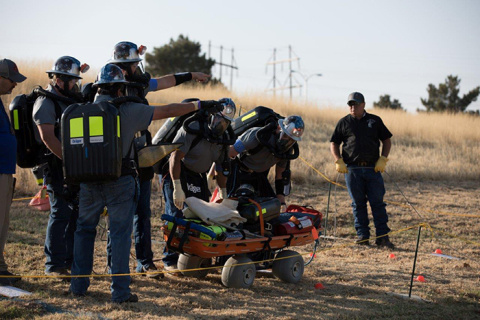 Waste Isolation Pilot Plant Blue Team members discuss a scenario during the mine rescue team competition.