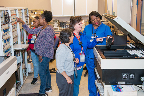 Savannah River National Laboratory employees work on nuclear measurements. From left, Chelsea Gaillard, Shirley Riley, Mira Malek, Gina Robbins, and Doris Williams.