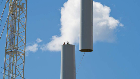 Photo of a wind turbine mid-construction.