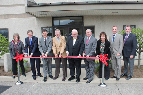 Officials cut the ceremonial ribbon to mark the opening of the Mound Cold War Discovery Center.