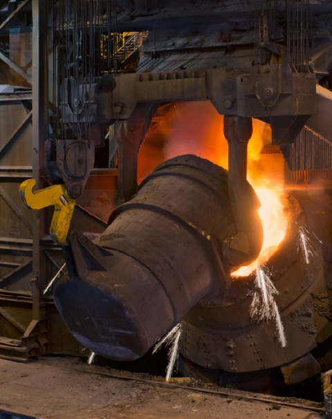 a photo of steel being smelted on an industrial scale.