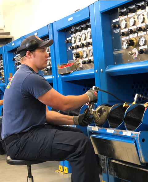 Carl Tilton with the Hanford Fire Department prepares a self-contained breathing apparatus bottle with breathable air that can be used by firefighters or workers in contaminated areas. Last month, firefighters filled more than 12,000 bottles.