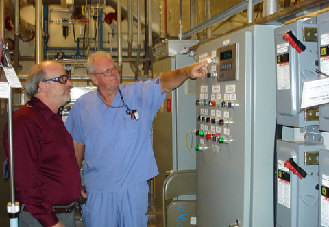 Mid-America Conversion Services Operator Bobby Ferren, right, is pictured with EM Depleted Uranium Hexafluoride Deputy Federal Project Director James Johnson at the Paducah cylinder transfer system startup. 
