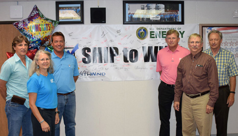 Employees gather to celebrate completing a full year of shipments to the Waste Isolation Pilot Plant.
