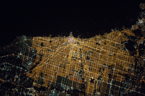 an arial view of a city at night showing the night lights.