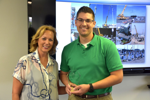 Nathan Morgan, a Washington River Protection Solutions project controls manager, stands with Junior Achievement regional director Susan Fillafer.