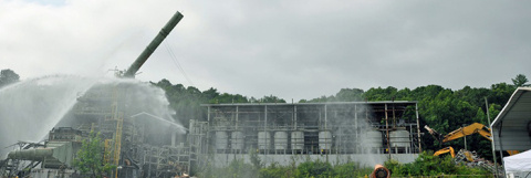 Crews take down a 100-foot stack at the Toxic Substances Control Act Incinerator.