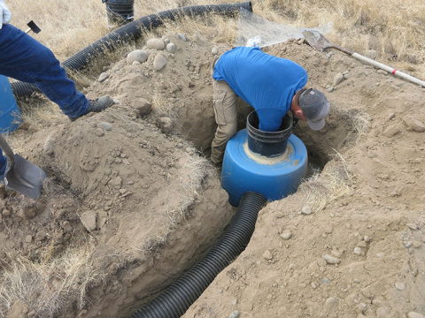 A worker prepares one of 45 new or upgraded homes for the burrowing owls. 