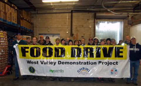 Crews from EM’s West Valley Demonstration Project Site gather alongside pallets stocked with donated food for delivery to area food pantries.