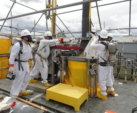 Washington River Protection Solutions employees remove a failed pump from double-shell tank AW-106.