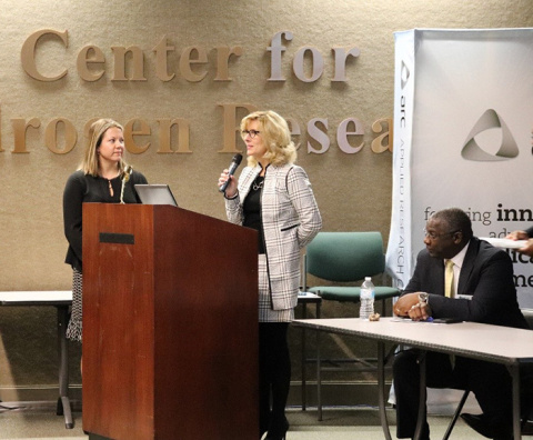 Sandra Fairchild speaks at the forum as SRR Small Business Program Manager Elizabeth Wooten and Johnson listen.