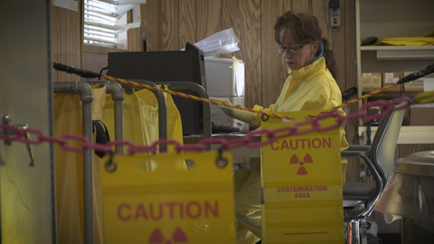Radiological Protection Inspector Wanda Patterson gathers information before beginning a radiological survey.