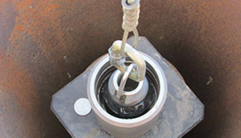 The custom-made “filter-swab” is used to capture perchloroethylene contamination in the tubing fluid of a deep aquifer monitoring well at DOE’s Idaho National Laboratory Site.