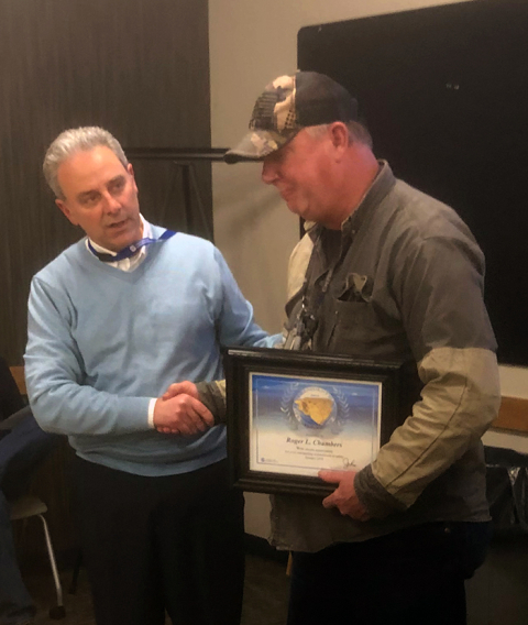 Hanford tank farms worker Roger Chambers, right, receives the President’s Lifesaving Award from Washington River Protection Solutions President John Eschenberg for providing assistance at the scene of a traffic accident involving two young pedestrians.