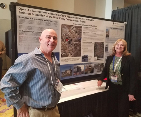 CH2MHILL BWXT West Valley (CHBWV) Regulatory Strategy Vice President Janice Williams and Brent Blunt, a consultant to CHBWV and subject-matter expert on air monitoring and modeling, stand in front of CHBWV’s informational poster at this year’s Waste Manag