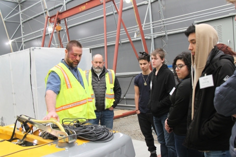 Hans Carman, left, and Matt Halsted with CH2M HILL Plateau Remediation Company show students equipment used at a Hanford Site mock-up. The recent tour highlighted the complexity of Hanford cleanup and allowed students to speak with professionals from a va